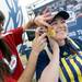 Michigan alumni Sarah Seedig, of Colorado, smiles as she has a block M painted on her cheek outside of the Georgia Dome before the start of the national championship game in Atlanta on Monday, April 8, 2013. Melanie Maxwell I AnnArbor.com